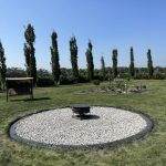Image of a fire pit with custom curbing and limestone material.