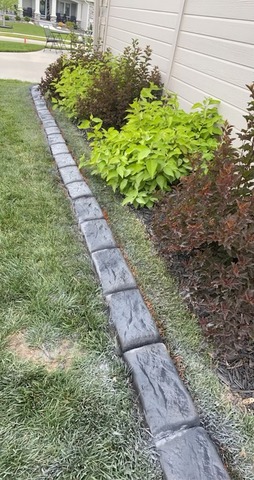 Hand Carved Slant curbing in the style of Parkland Paver.